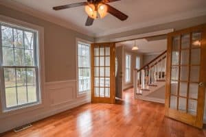 An interior view of an unoccupied brown and white wooden contemporary house