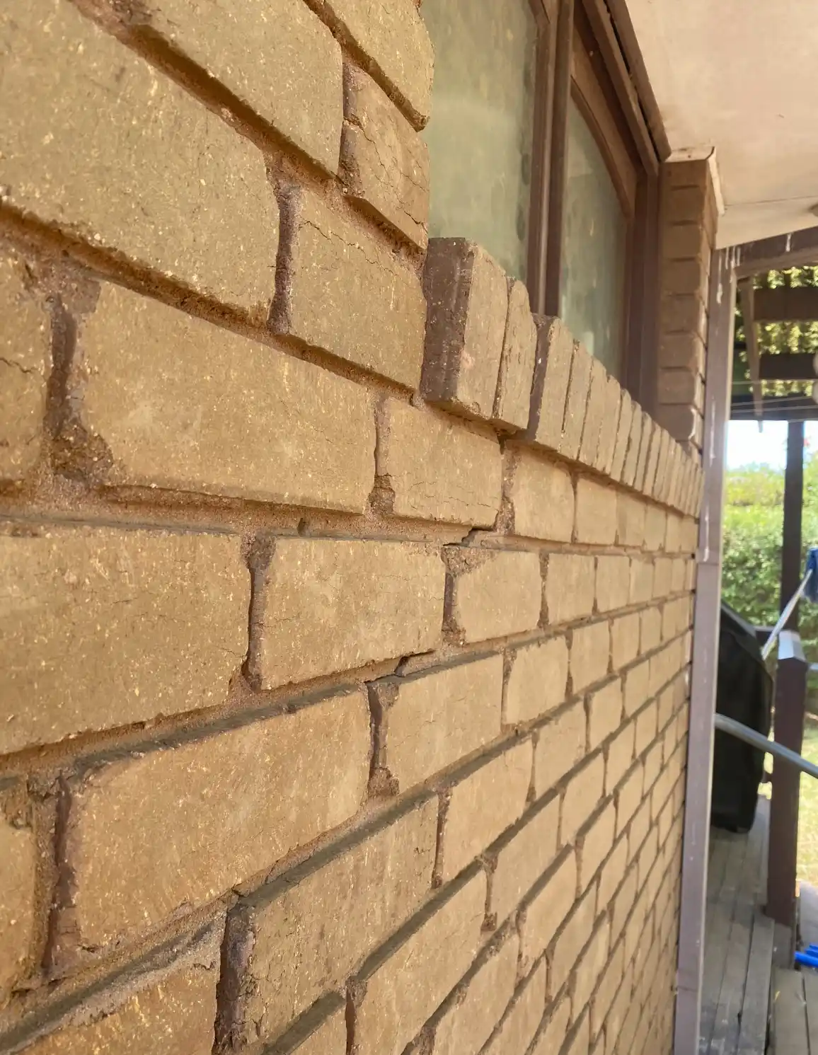 Cracked brickwork showing signs of foundation movement found during a building inspection