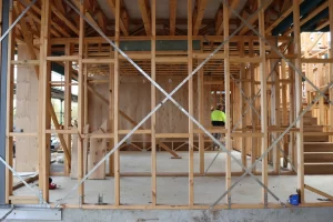 Timber frame and foundation bracing checked during a new home stage inspection