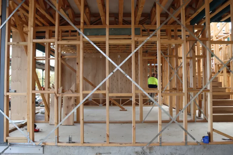 Timber frame and foundation bracing checked during a new home stage inspection