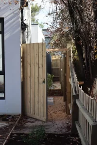Newly installed timber gate and fence inspected during Melbourne pre-handover inspection